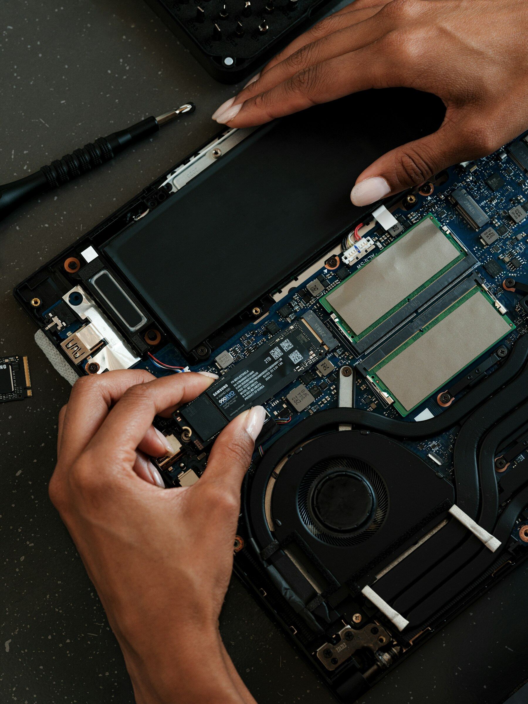 Laptop open on the bench ready for repair and setup